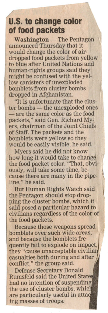 Newspaper clipping about unexploded cluster bombs in Afghanistan.
